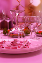 Buffet table with dishware waiting for guests