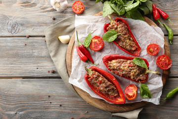 Delicious stuffed peppers on table close-up