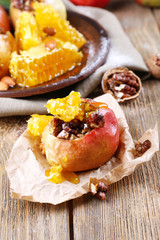 Baked apples on table close up