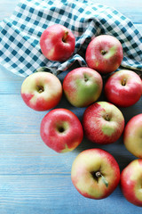Juicy apples on wooden table, close-up