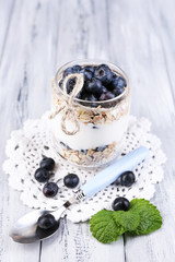 Obraz na płótnie Canvas Healthy breakfast - yogurt with blueberries and muesli served