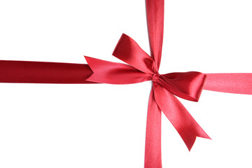 Shiny red ribbon with bow isolated on white