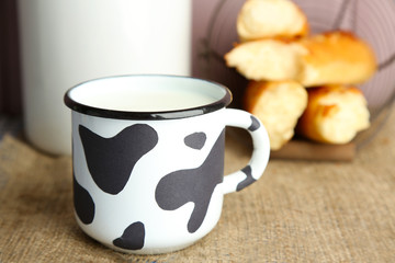 Retro still life with tasty rustic milk, on table