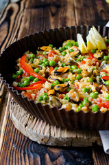 Paella with mussels and green peas