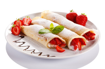 Pancakes with cream and strawberries