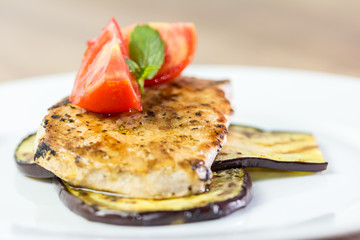 Grilled Eggplant Slice With Pork Chop And Sliced Tomatoes