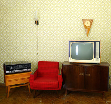 Vintage room with wallpaper, old fashioned armchair, retro tv, c