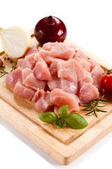 Raw tourkey meat on cutting board on white background