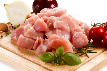 Raw tourkey meat on cutting board on white background