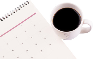 A mug of coffee and table day planner