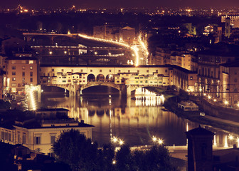 Fototapeta na wymiar Florence, Arno River and Ponte Vecchio by night.