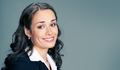 Portrait of young happy smiling businesswoman