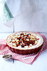 Shortcrust plum tart with coconut crumble