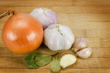 garlic and onion on cutting board