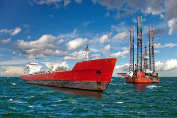 Oil rig and tanker ship on offshore area.