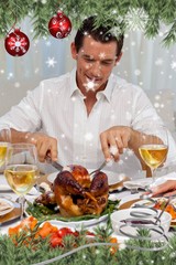 Attractive man eating turkey in christmas diner