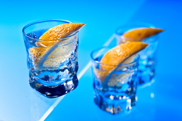 gin with lemon on a glass table