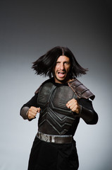 Angry warrior against dark background