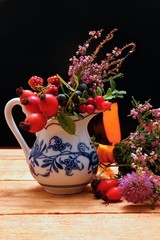 Vase with wild berries