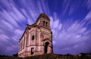 The old church flying in stormy clouds - 70726339