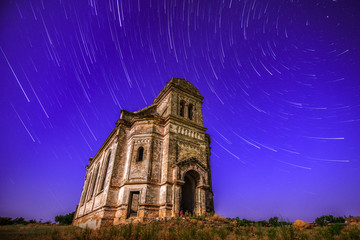 The old church flying in star trails - 70726390