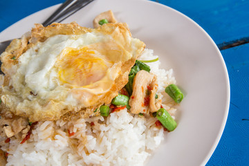 fried basil chicken with fried egg and rice, Thai popular food
