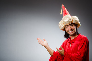 Funny wizard wearing red dress