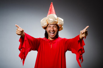 Funny wizard wearing red dress
