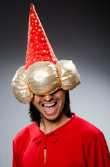 Funny wizard wearing red dress