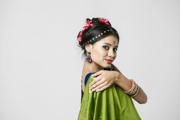 Young pretty woman in indian green dress