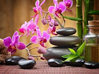 Fototapeta na wymiar spa concept zen basalt stones and orchid