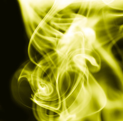 yellow smoke on a black background