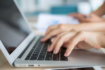 Close-up of business person use laptop with financial diagram