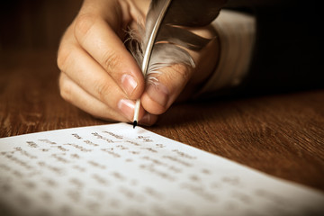 Fototapeta writer writes a fountain pen on paper work obraz