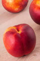Three tasty fresh ripe juicy nectarines