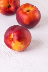 Three tasty fresh ripe juicy nectarines