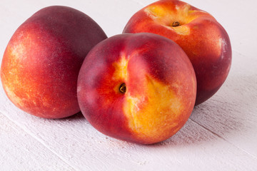 Three tasty fresh ripe juicy nectarines