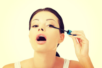 Woman face with mascara brush