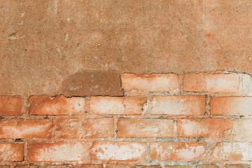 brick wall with cracked plaster - texture