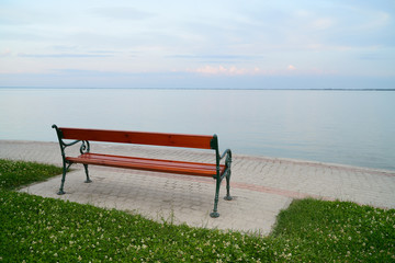 Naklejka na ściany i meble Empty bench at lake Balaton