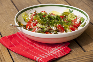 Bowl of Marinated Greek Salad with Red Napkin