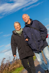 happy mature couple relaxing baltic sea dunes