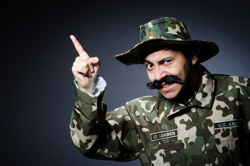 Funny soldier in military concept