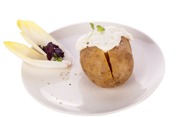 Baked jacket potato with sour cream sauce