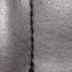 Black leather as a background. close-up