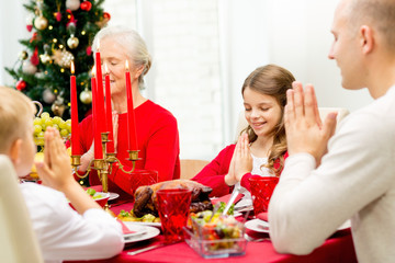 smiling family having holiday dinner at home