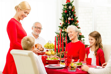 smiling family having holiday dinner at home