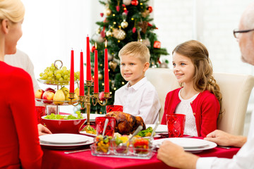 smiling family having holiday dinner at home