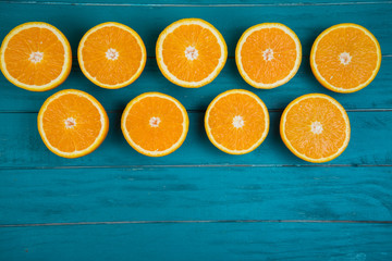 Fresh organic oranges on wooden background