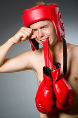 Funny boxer against dark background